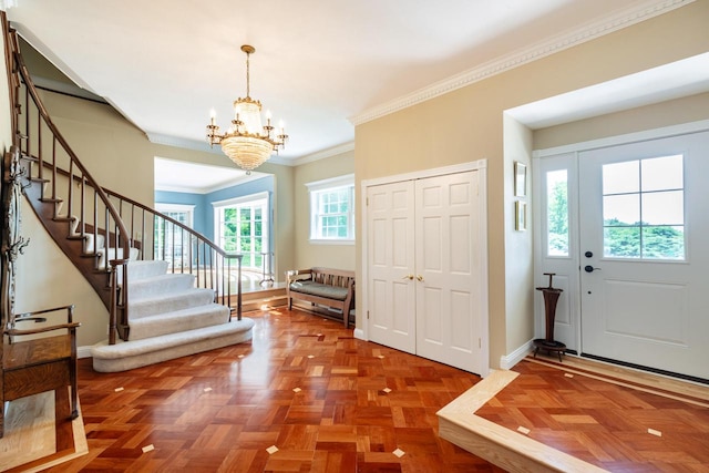N2194 Valley Rd, La Crosse, WI 54601 - entryway featuring a chandelier, stairs, and crown molding