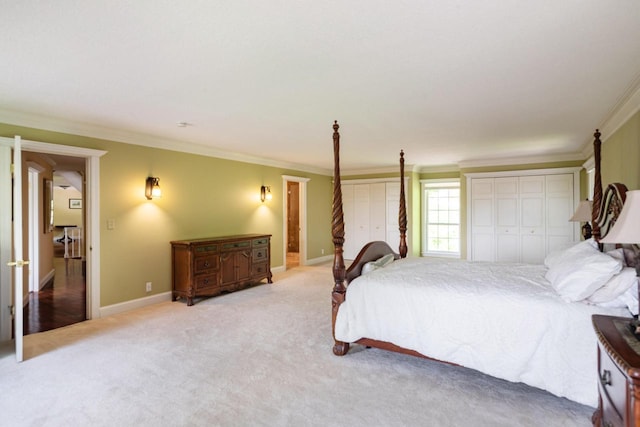 N2194 Valley Rd, La Crosse, WI 54601 - bedroom with multiple closets, ornamental molding, and carpet flooring