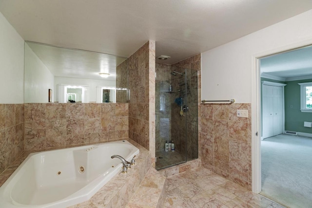 N2194 Valley Rd, La Crosse, WI 54601 - full bathroom featuring a shower stall, a jetted tub, and tile walls