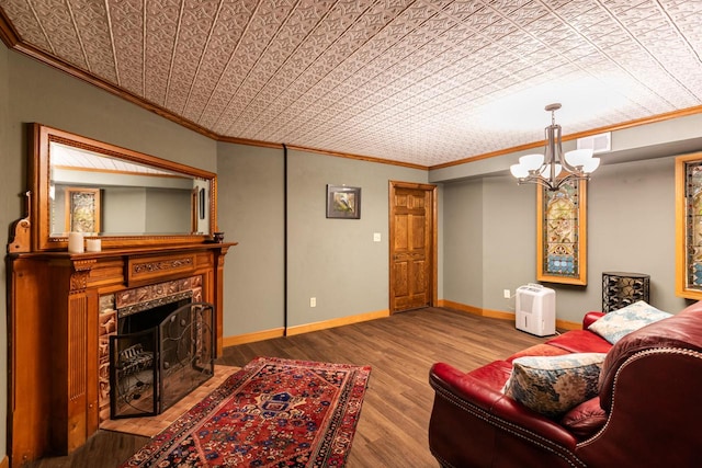 N2194 Valley Rd, La Crosse, WI 54601 - living area with crown molding, a chandelier, an ornate ceiling, wood finished floors, and a high end fireplace