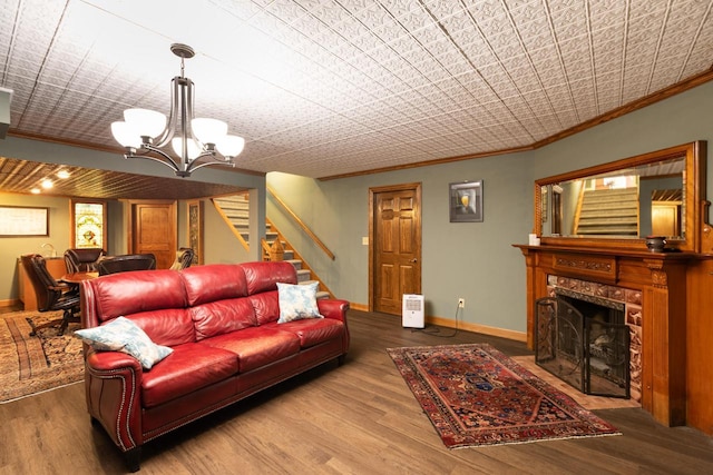 N2194 Valley Rd, La Crosse, WI 54601 - living area featuring crown molding, stairs, a chandelier, wood finished floors, and a high end fireplace