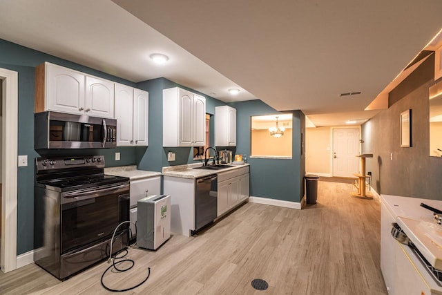 N2194 Valley Rd, La Crosse, WI 54601 - kitchen with stainless steel microwave, electric range oven, dishwasher, and light wood-type flooring