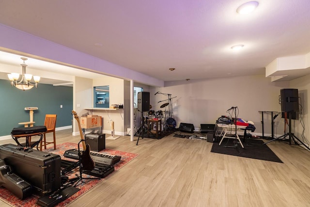 N2194 Valley Rd, La Crosse, WI 54601 - exercise room with light wood finished floors and a chandelier