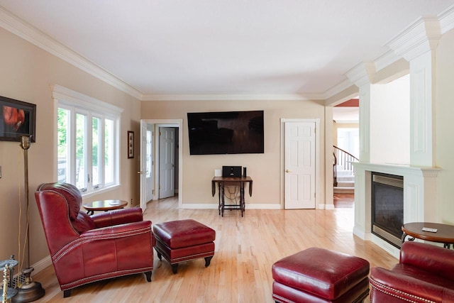 N2194 Valley Rd, La Crosse, WI 54601 - living room with wood finished floors, decorative columns, ornamental molding, and stairs