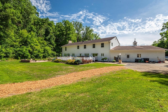 N2194 Valley Rd, La Crosse, WI 54601 - back of house with a patio area, a lawn, and a chimney