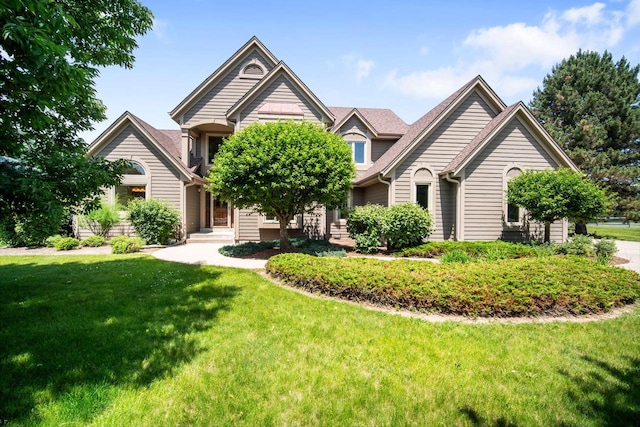 N65W38340 S Woodlake Cir, Oconomowoc, WI 53066 - view of front of home featuring a front lawn