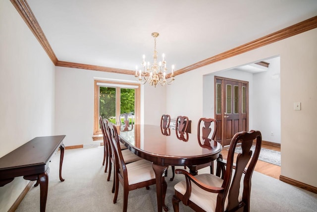 N65W38340 S Woodlake Cir, Oconomowoc, WI 53066 - dining area featuring crown molding, a chandelier, and light carpet