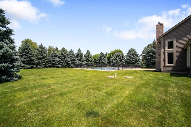 N65W38340 S Woodlake Cir, Oconomowoc, WI 53066 - view of green lawn with an outdoor pool