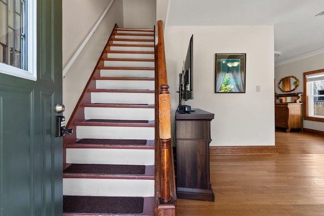 931 Carney Blvd, Marinette, WI 54143 - stairway featuring wood finished floors and crown molding