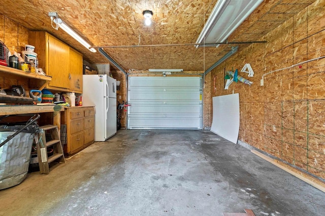 931 Carney Blvd, Marinette, WI 54143 - garage with freestanding refrigerator