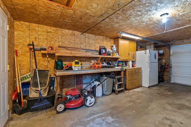 931 Carney Blvd, Marinette, WI 54143 - garage featuring freestanding refrigerator