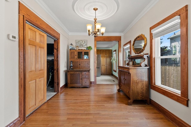 931 Carney Blvd, Marinette, WI 54143 - hall with a chandelier, light wood finished floors, and crown molding