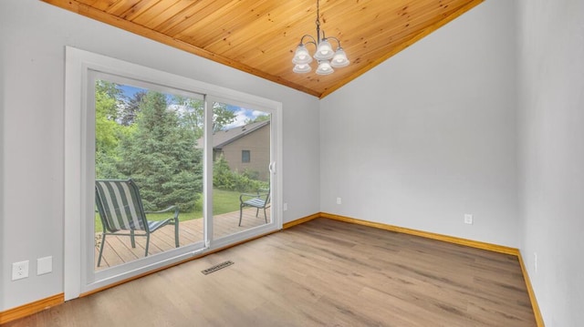N3923 Sunny Slope Ave, Cascade, WI 53011 - unfurnished room with a chandelier, wood finished floors, vaulted ceiling, and wood ceiling