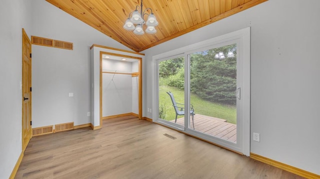 N3923 Sunny Slope Ave, Cascade, WI 53011 - unfurnished room featuring vaulted ceiling, a chandelier, wood finished floors, and wood ceiling