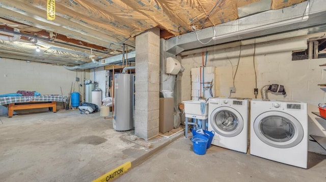 N3923 Sunny Slope Ave, Cascade, WI 53011 - unfinished basement with water heater, washer and clothes dryer, and a water pressure tank