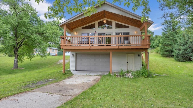 N3923 Sunny Slope Ave, Cascade, WI 53011 - view of front of house with driveway, a front lawn, an attached garage, and a wooden deck