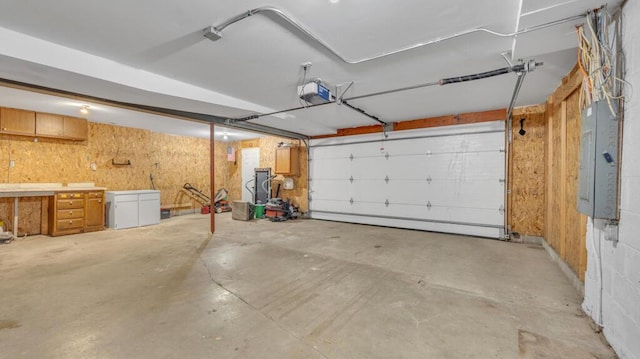 N3923 Sunny Slope Ave, Cascade, WI 53011 - garage with electric panel and a garage door opener