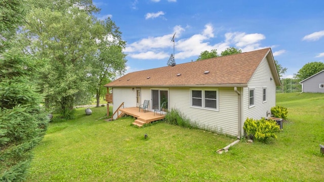 N3923 Sunny Slope Ave, Cascade, WI 53011 - rear view of house featuring a deck, a lawn, and roof with shingles