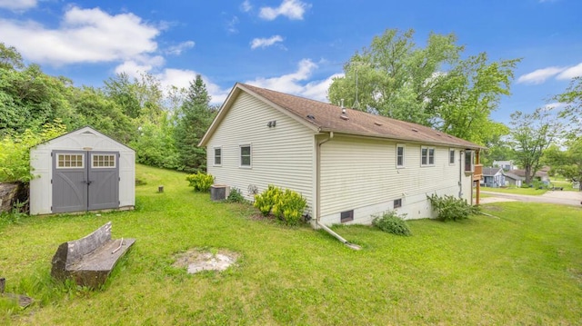 N3923 Sunny Slope Ave, Cascade, WI 53011 - view of side of home with a storage shed and a lawn
