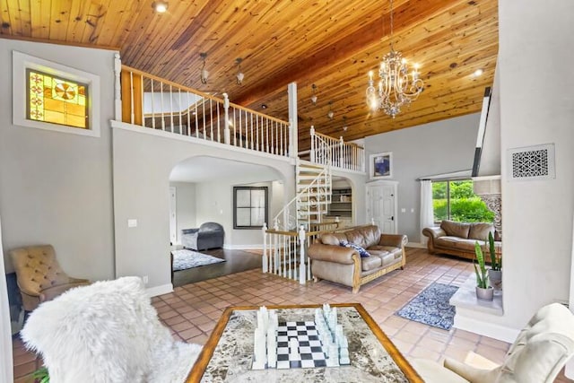 205 Kummrow Ct, Wales, WI 53183 - living area with arched walkways, high vaulted ceiling, stairway, wooden ceiling, and a chandelier