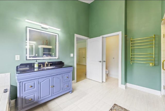 205 Kummrow Ct, Wales, WI 53183 - bathroom with radiator heating unit, vanity, a high ceiling, and a shower