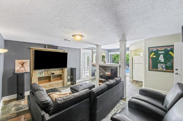 205 Kummrow Ct, Wales, WI 53183 - living area with decorative columns and a textured ceiling