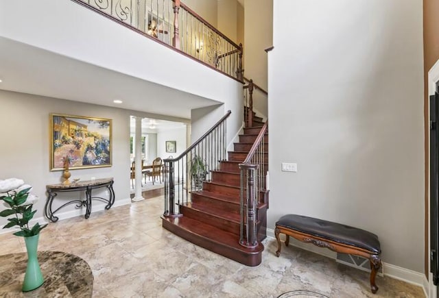 205 Kummrow Ct, Wales, WI 53183 - entryway featuring stairs, decorative columns, and a towering ceiling