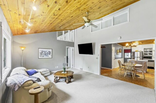 205 Kummrow Ct, Wales, WI 53183 - carpeted living area with wood ceiling, a ceiling fan, high vaulted ceiling, and a chandelier