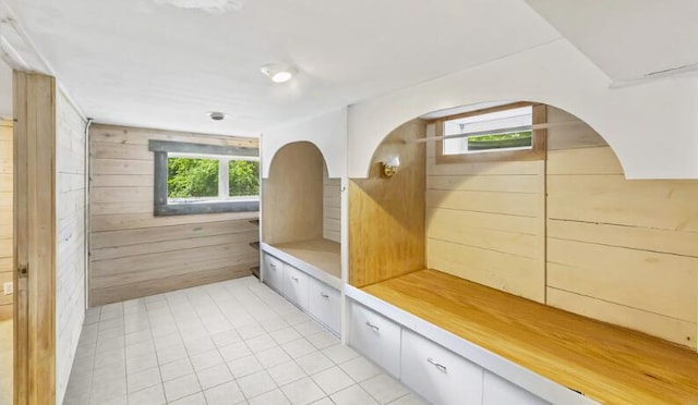 205 Kummrow Ct, Wales, WI 53183 - mudroom with wooden walls, light tile patterned floors, and arched walkways