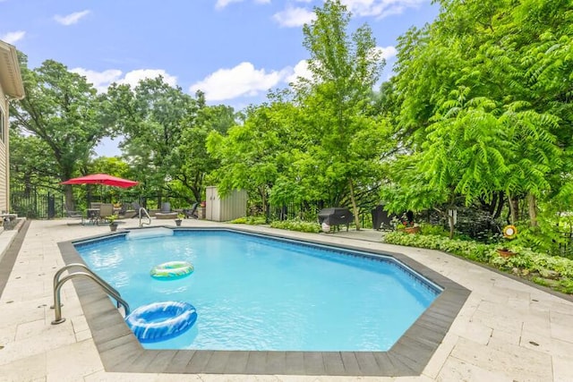 205 Kummrow Ct, Wales, WI 53183 - view of swimming pool featuring a storage unit, grilling area, and a patio area