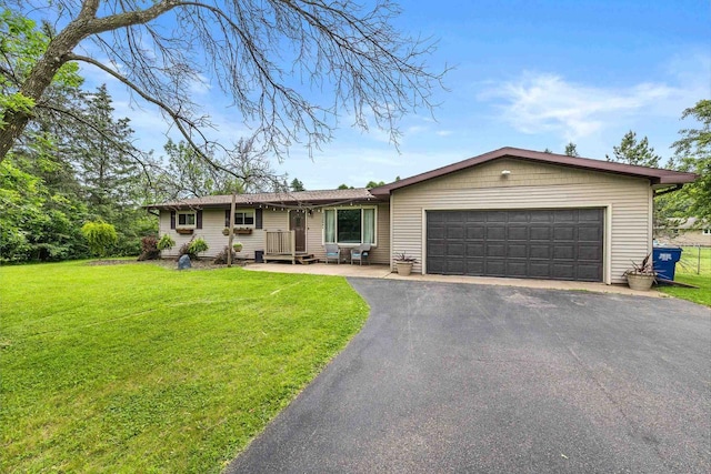 222531 Azalea Rd, Wausau, WI 54401 - ranch-style home featuring a garage, asphalt driveway, and a front yard