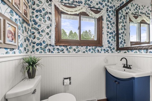 222531 Azalea Rd, Wausau, WI 54401 - half bath featuring wallpapered walls, wainscoting, and vanity