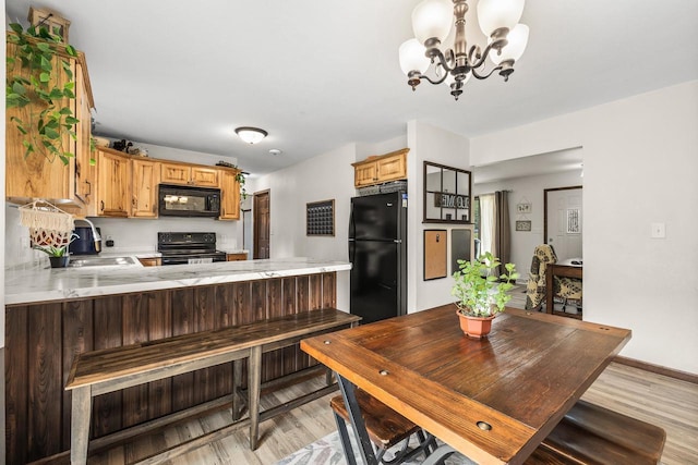 222531 Azalea Rd, Wausau, WI 54401 - dining area with light wood-style flooring and a chandelier