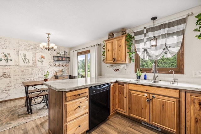 222531 Azalea Rd, Wausau, WI 54401 - kitchen with dishwasher, a chandelier, a peninsula, wood finished floors, and wallpapered walls