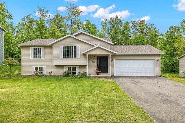 6611 Conner Davis Dr, Wausau, WI 54401 - tri-level home featuring an attached garage, asphalt driveway, a front lawn, and a shingled roof