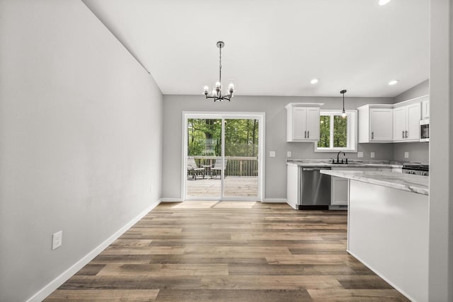 6611 Conner Davis Dr, Wausau, WI 54401 - kitchen featuring appliances with stainless steel finishes, a chandelier, white cabinets, recessed lighting, and dark wood-type flooring