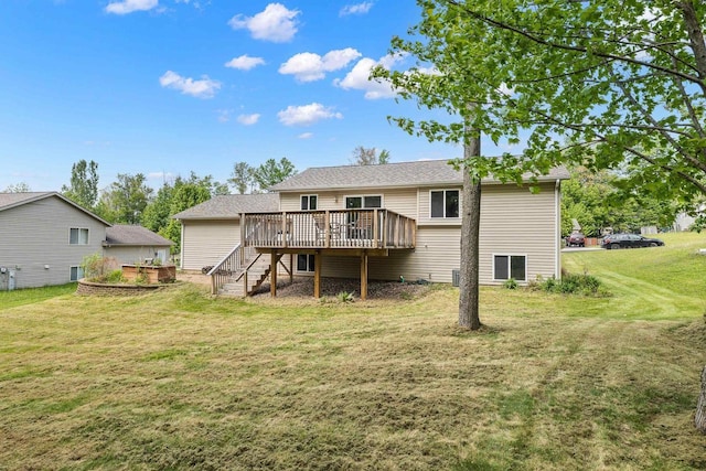 6611 Conner Davis Dr, Wausau, WI 54401 - back of property featuring a deck, a lawn, and stairway