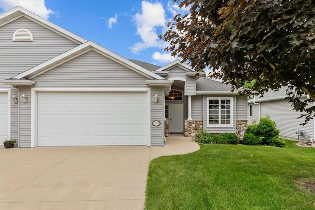 2506 Waterford Ct, Neenah, WI 54956 - view of front of property with driveway, a front yard, a garage, stone siding, and roof with shingles
