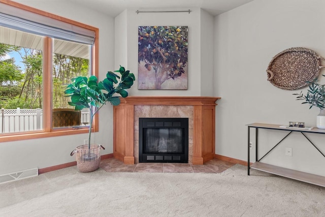 2506 Waterford Ct, Neenah, WI 54956 - carpeted living room featuring a tile fireplace and baseboards