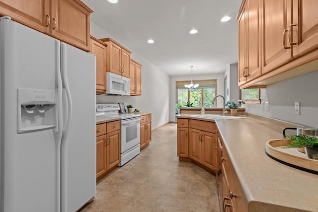 2506 Waterford Ct, Neenah, WI 54956 - kitchen with white appliances, recessed lighting, light countertops, a peninsula, and hanging light fixtures
