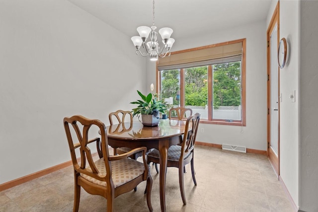 2506 Waterford Ct, Neenah, WI 54956 - dining room with a chandelier and baseboards