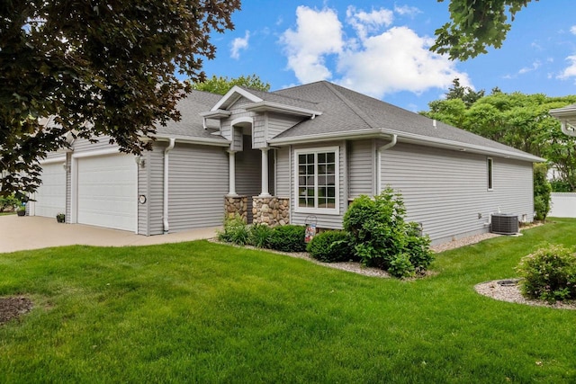 2506 Waterford Ct, Neenah, WI 54956 - view of front of home with an attached garage, driveway, a front yard, and a shingled roof