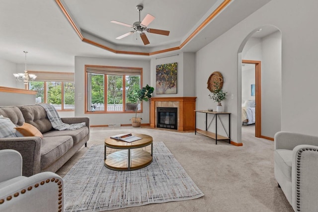 2506 Waterford Ct, Neenah, WI 54956 - living area with a chandelier, carpet flooring, a raised ceiling, a ceiling fan, and a fireplace