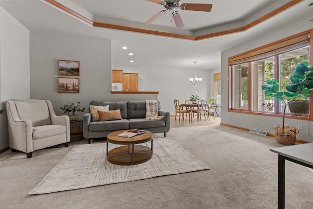 2506 Waterford Ct, Neenah, WI 54956 - living area with a tray ceiling, light carpet, a chandelier, ceiling fan, and recessed lighting