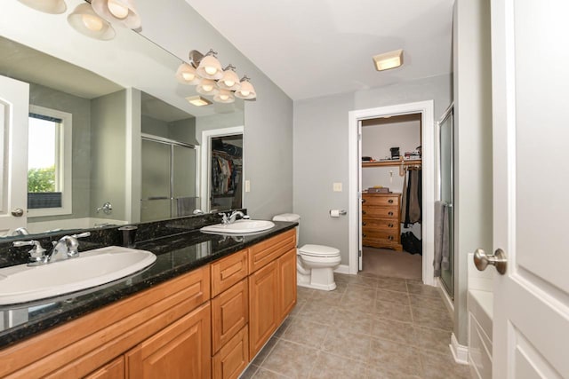 953 Eagleton Dr Unit 46-05, Lake Geneva, WI 53147 - full bath with a spacious closet, a shower stall, double vanity, and tile patterned floors