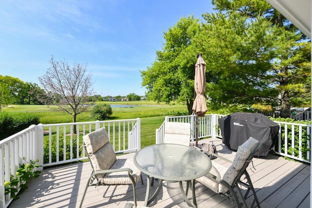 953 Eagleton Dr Unit 46-05, Lake Geneva, WI 53147 - wooden terrace with area for grilling, a water view, and outdoor dining area