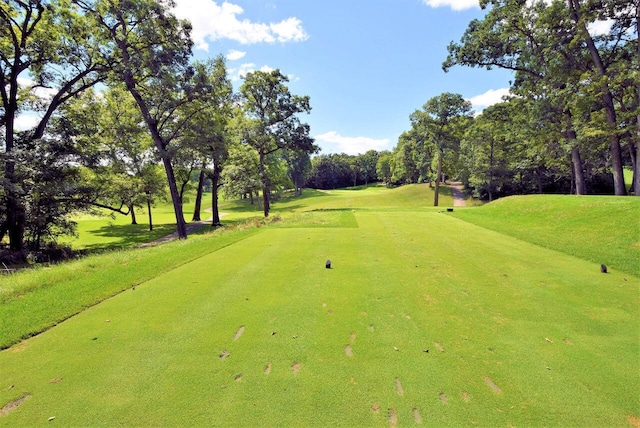 953 Eagleton Dr Unit 46-05, Lake Geneva, WI 53147 - surrounding community with view of wooded area, view of golf course, and a lawn