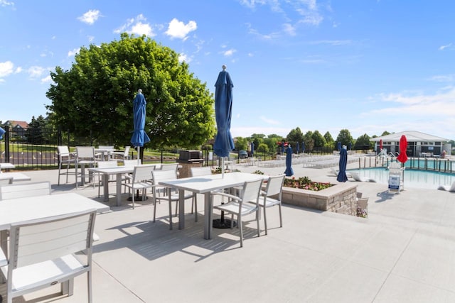 953 Eagleton Dr Unit 46-05, Lake Geneva, WI 53147 - view of patio / terrace featuring outdoor dining space and a community pool