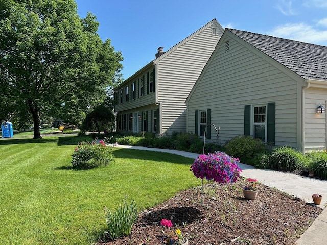 10800 N Norway Dr, Mequon, WI 53092 - view of side of property with a yard and a chimney