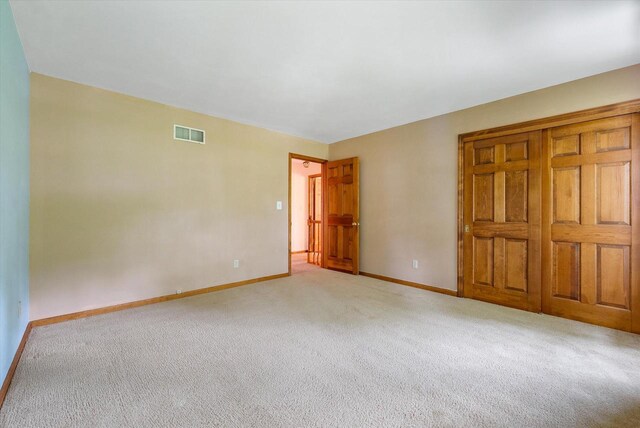 10800 N Norway Dr, Mequon, WI 53092 - unfurnished bedroom with light carpet and baseboards